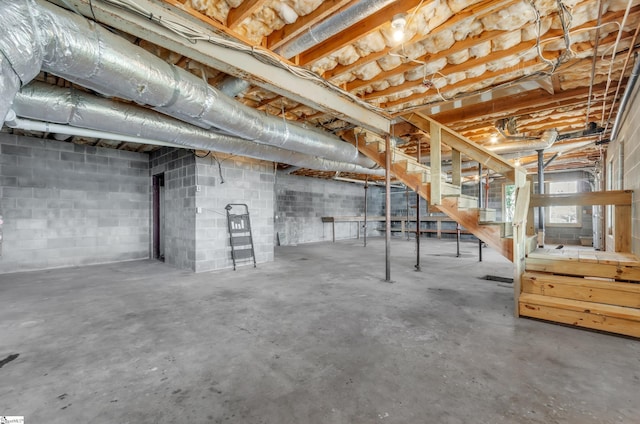 basement featuring stairs