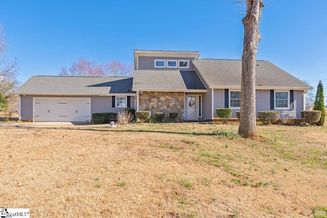 view of front of house featuring a garage, stone siding, a shingled roof, and a front yard