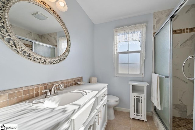 bathroom with toilet, visible vents, vanity, a shower stall, and tasteful backsplash