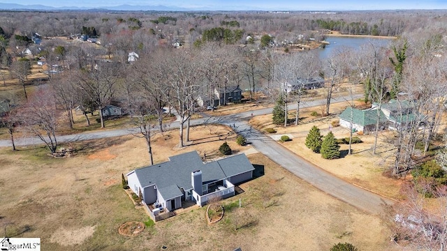 bird's eye view with a forest view and a water view