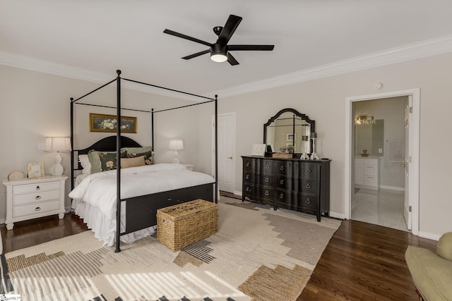 bedroom featuring crown molding, a ceiling fan, connected bathroom, wood finished floors, and baseboards