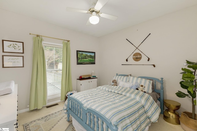 bedroom with light carpet, ceiling fan, visible vents, and baseboards