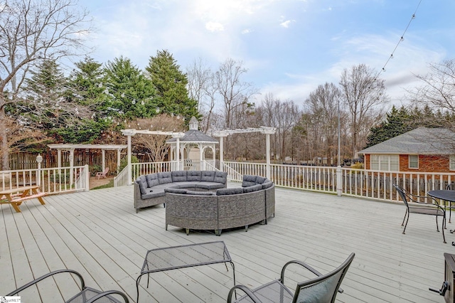 wooden deck featuring an outdoor hangout area and a gazebo