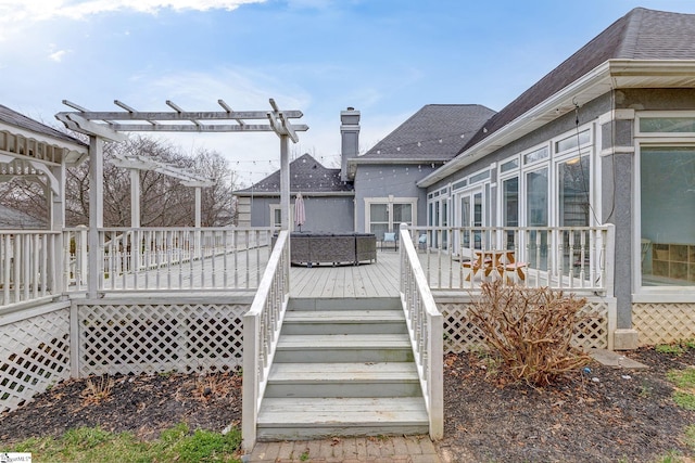 deck with stairs, a sunroom, and a pergola