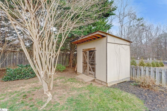 view of shed with fence