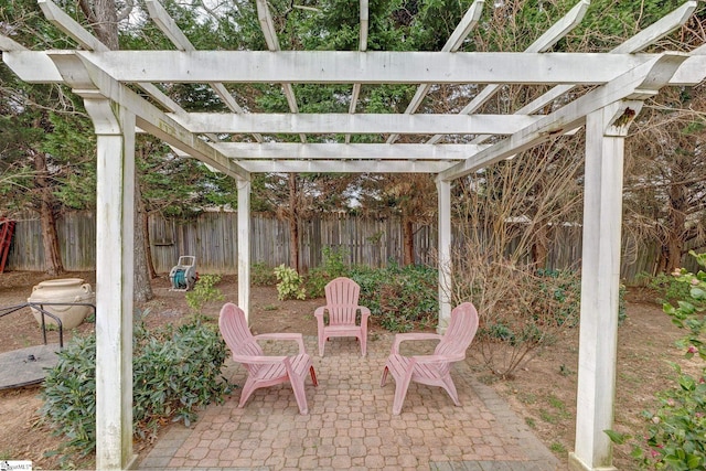 view of patio / terrace with a fenced backyard and a pergola