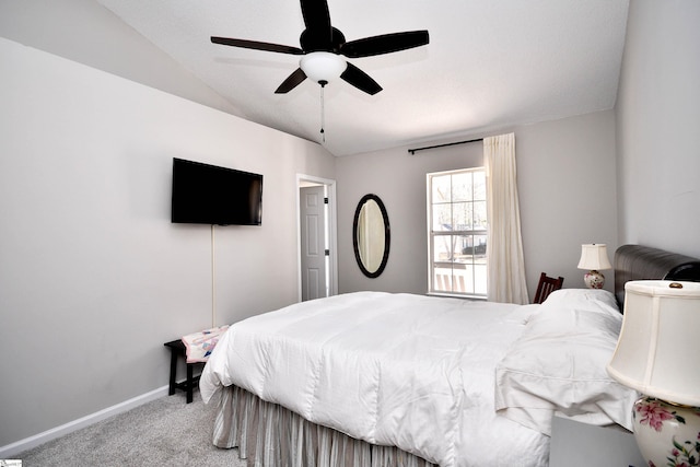 bedroom with vaulted ceiling, carpet, a ceiling fan, and baseboards