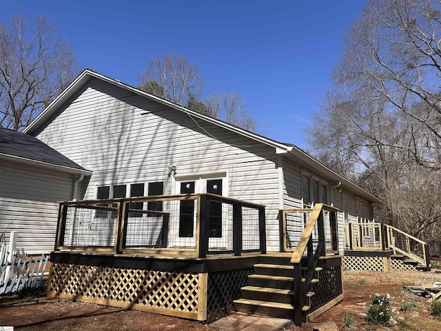 view of side of home with a deck