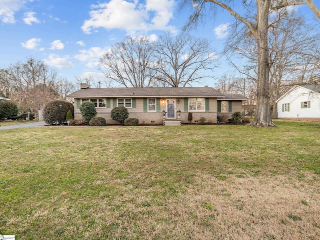 ranch-style home with a chimney, driveway, crawl space, and a front yard