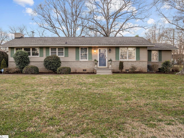 single story home featuring crawl space, brick siding, a chimney, and a front yard