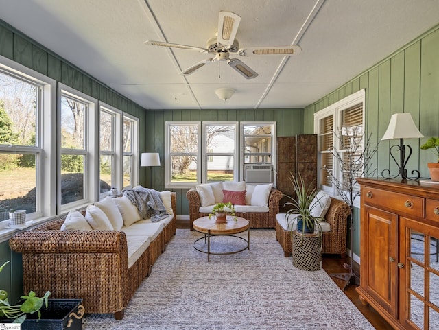 sunroom featuring a ceiling fan and cooling unit