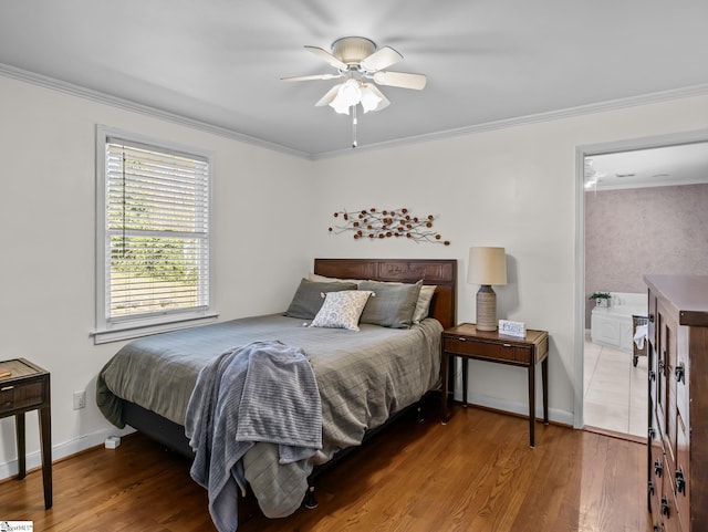 bedroom featuring baseboards, ceiling fan, wood finished floors, and crown molding