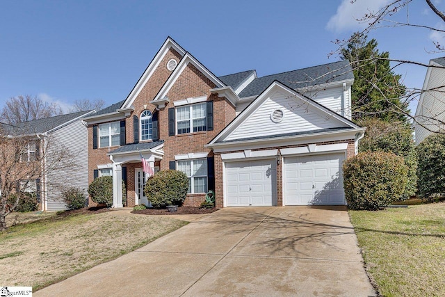 view of front of property with a front lawn, concrete driveway, brick siding, and an attached garage