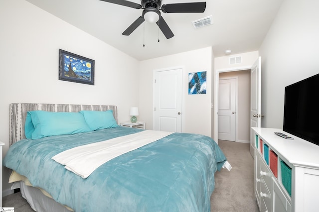 bedroom with a ceiling fan, light carpet, and visible vents