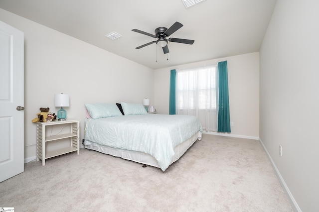 carpeted bedroom with baseboards, visible vents, and ceiling fan