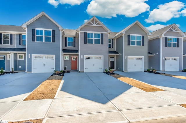 view of front of property featuring a garage and driveway
