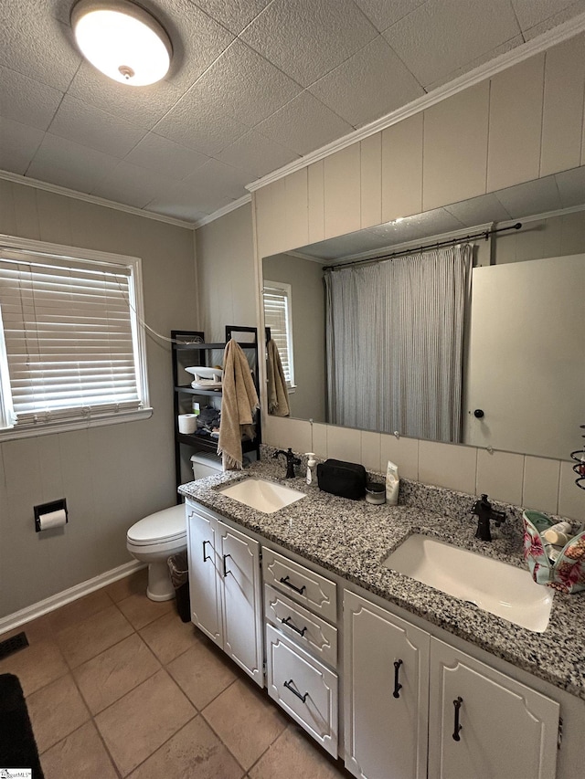 bathroom featuring crown molding, visible vents, a sink, and toilet