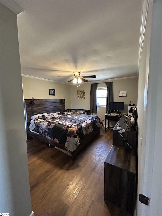 bedroom featuring a ceiling fan, ornamental molding, and dark wood-type flooring