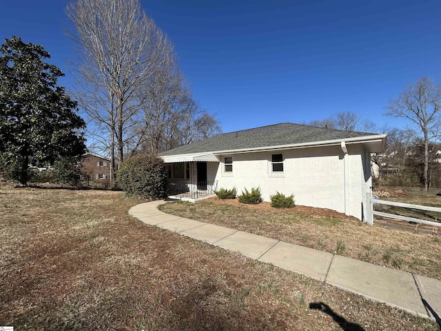 exterior space with a shingled roof