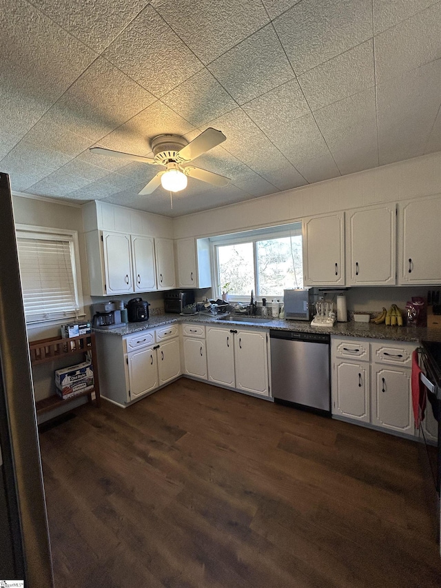 kitchen with dishwasher, dark wood-style flooring, a sink, and white cabinets