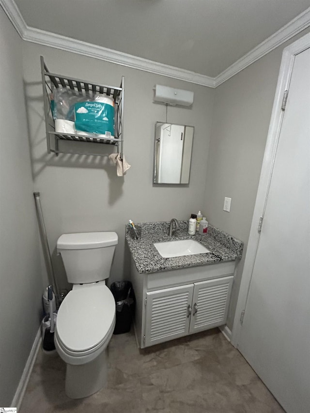 half bath featuring toilet, baseboards, vanity, and crown molding