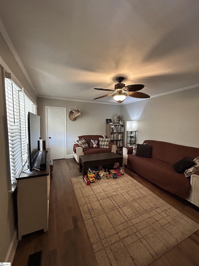 living room featuring dark wood-style floors, ceiling fan, and ornamental molding