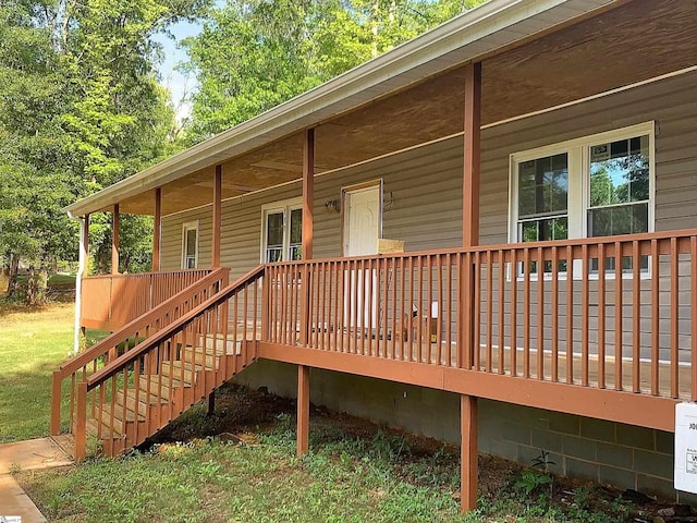 deck with a porch and stairway