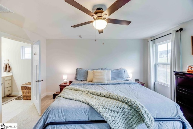 bedroom featuring light carpet, multiple windows, and visible vents