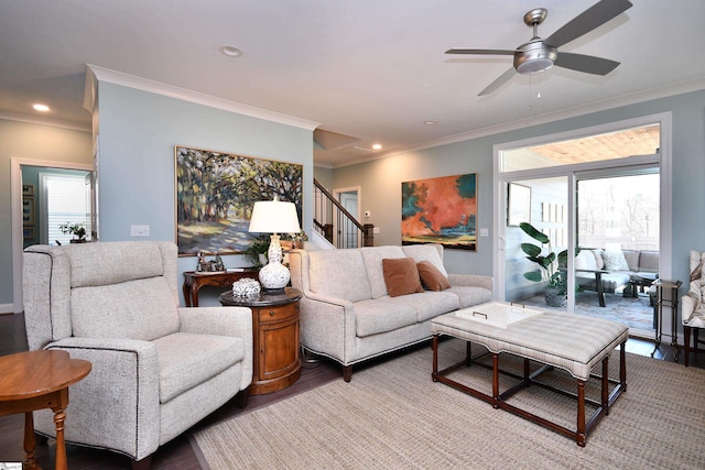 living room featuring a ceiling fan, wood finished floors, stairs, crown molding, and recessed lighting