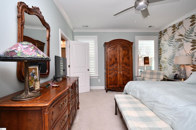 bedroom featuring ceiling fan, ornamental molding, visible vents, and light colored carpet