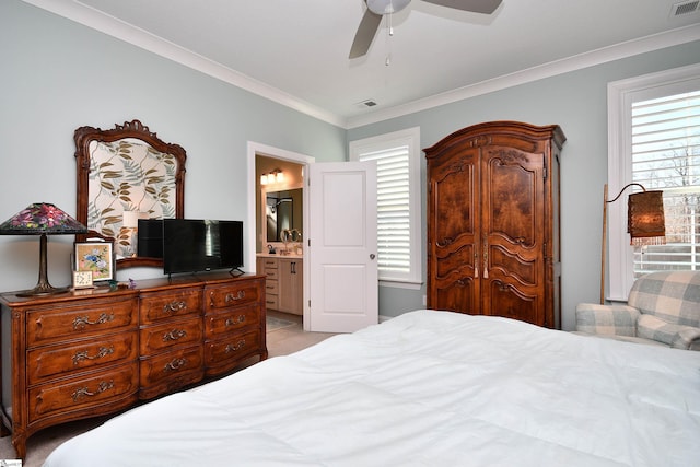 bedroom featuring ceiling fan, connected bathroom, visible vents, and crown molding