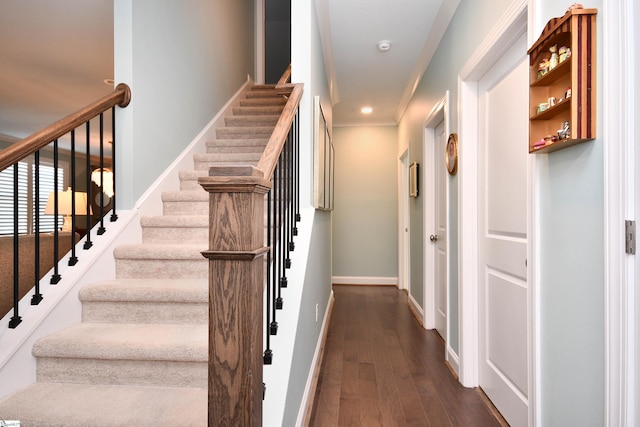 stairs with baseboards and wood finished floors