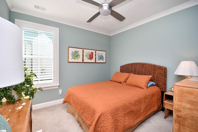 bedroom featuring light carpet, multiple windows, visible vents, and crown molding