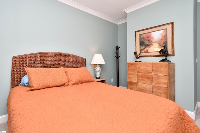 bedroom with baseboards and crown molding