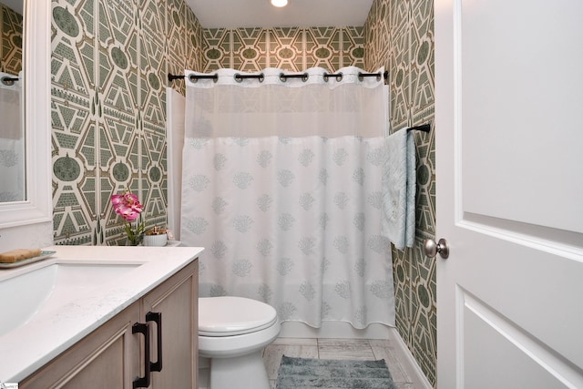 bathroom featuring toilet and vanity