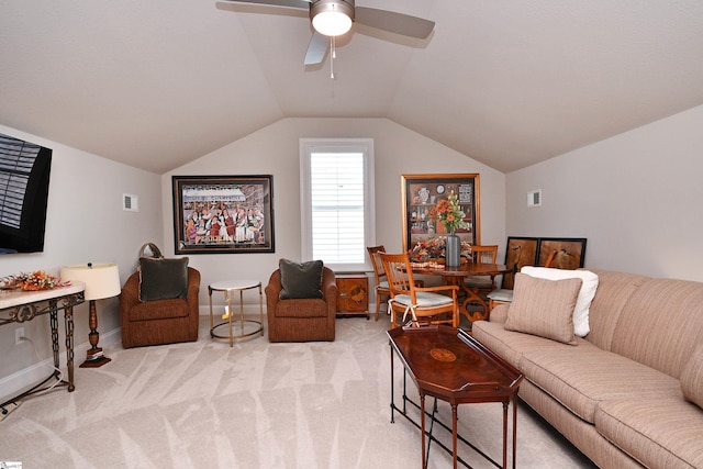 living room featuring light carpet, visible vents, a ceiling fan, and lofted ceiling