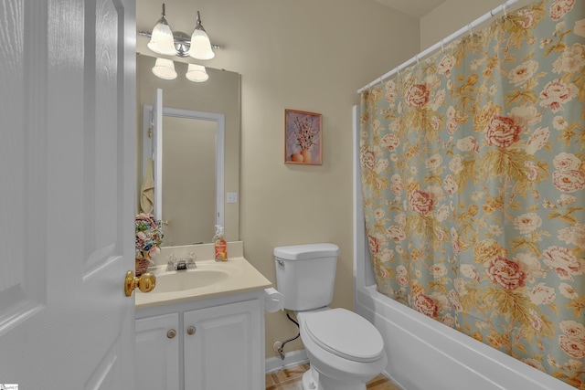 bathroom with toilet, shower / bath combination with curtain, and vanity