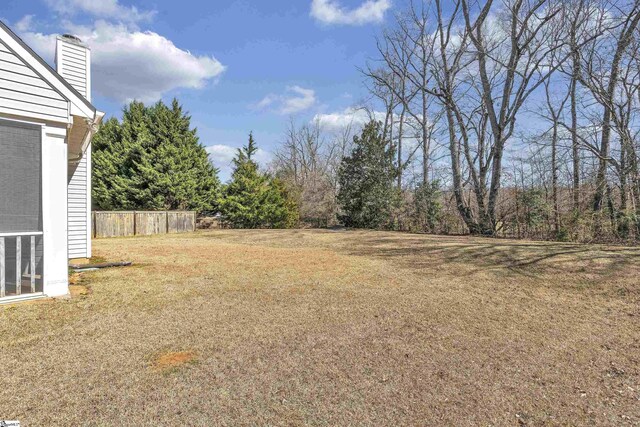 view of yard featuring fence