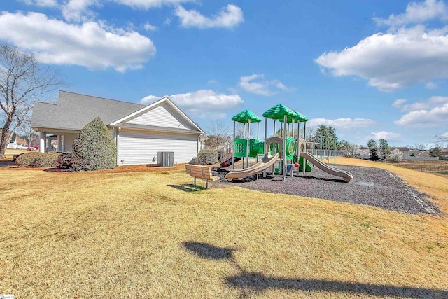 communal playground featuring cooling unit and a yard