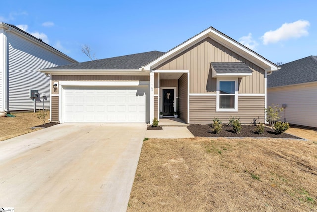 view of front of home with a garage, driveway, roof with shingles, and board and batten siding