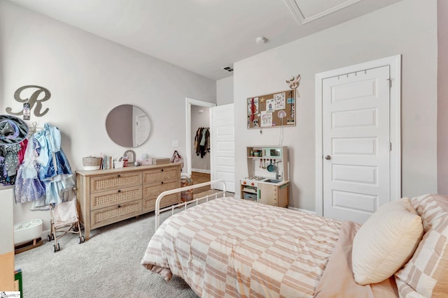 bedroom with visible vents and carpet flooring