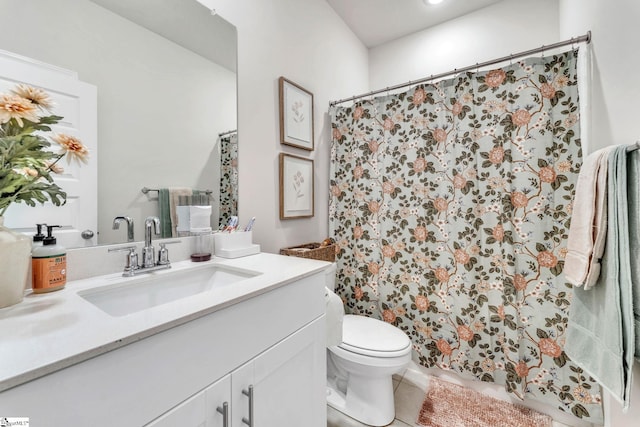 full bath featuring curtained shower, vanity, toilet, and tile patterned floors