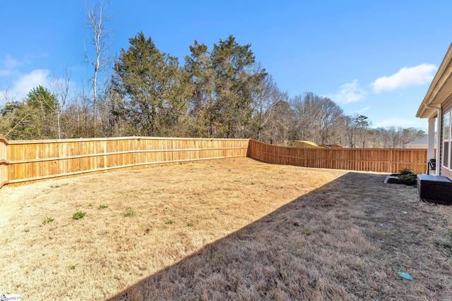 view of yard with a fenced backyard