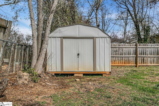 view of shed with a fenced backyard