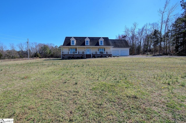 new england style home featuring a garage and a front yard