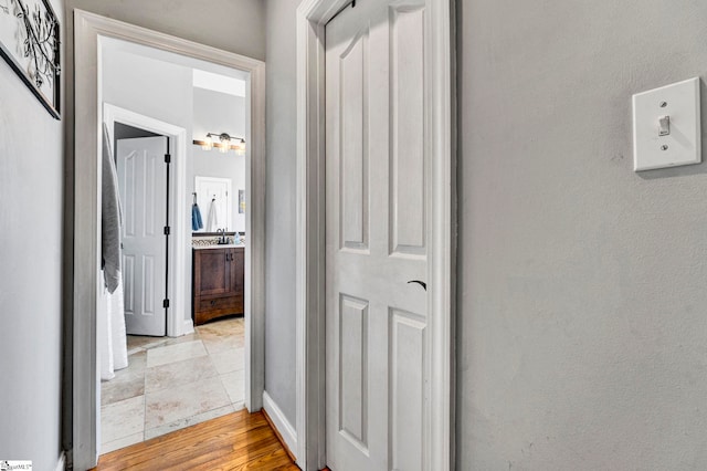 hallway featuring light wood-style floors