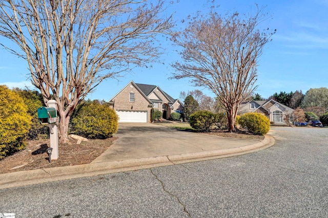 traditional-style house with concrete driveway