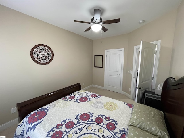 bedroom with baseboards, ceiling fan, and light colored carpet