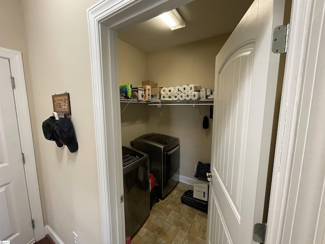 washroom featuring laundry area, independent washer and dryer, and baseboards