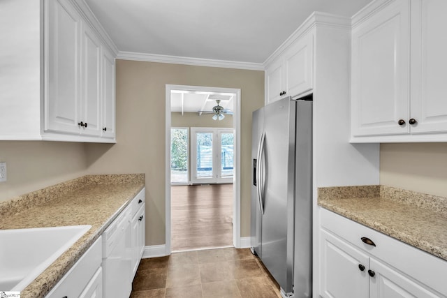 kitchen with white cabinets, ceiling fan, and stainless steel refrigerator with ice dispenser